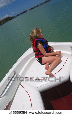 Picture - Girl riding in boat. Fotosearch