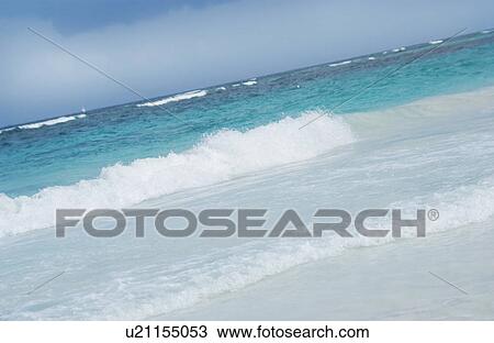 Stock Image - Ocean waves coming ashore. Fotosearch
