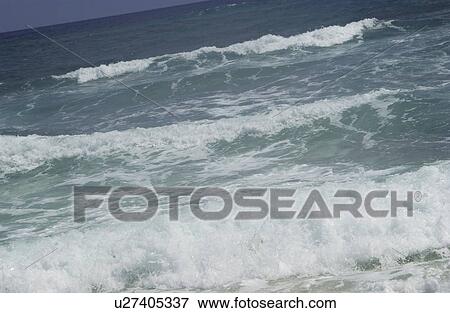 Stock Photo - Ocean waves coming ashore. Fotosearch