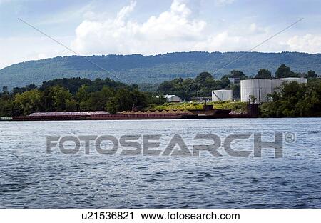 Riverfront barges parked along shore View Large Photo Image Stock Image - Riverfront barges parked along shore. Fotosearch