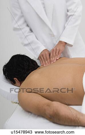 Stock Image - Man getting a massage. Fotosearch