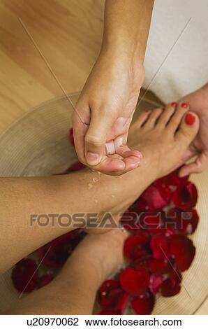 Stock Image - Woman getting a foot massage or pedicure. Fotosearch