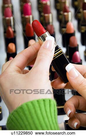 Woman shopping for lipstick View Large Photo Image Stock Image - Woman shopping for lipstick. Fotosearch