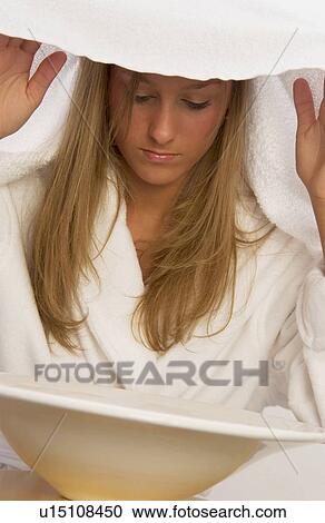 Woman steaming her head View Large Photo Image Stock Image - Woman steaming her head. Fotosearch