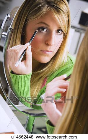 Woman testing eye liner View Large Photo Image Stock Photo - Woman testing eye liner. Fotosearch