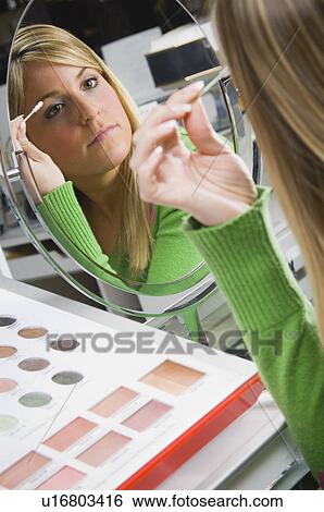 Woman testing eye shadow View Large Photo Image Stock Photograph - Woman testing eye shadow. Fotosearch