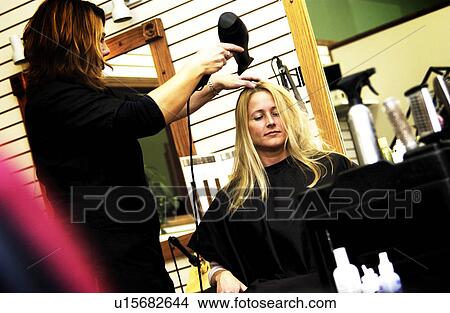 Woman getting a haircut View Large Photo Image Picture - Woman getting a haircut. Fotosearch