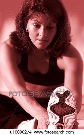 Picture - Woman stretching. Fotosearch