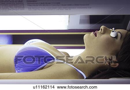 Picture - Woman tanning. Fotosearch