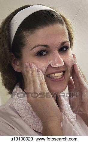 Stock Image - Woman washing face. Fotosearch