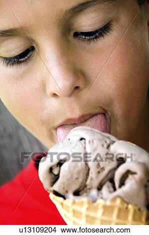 Boy eating ice cream cone View Large Photo Image Picture - Boy eating ice cream cone. Fotosearch