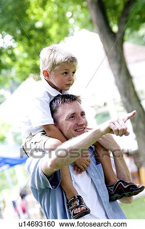 Father with son on shoulders View Large Photo Image Stock Image - Father with son on shoulders. Fotosearch