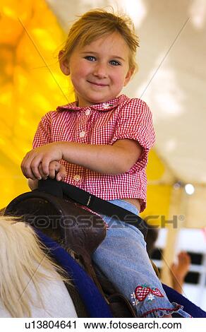 Girl on pony ride View Large Photo Image Stock Image - Girl on pony ride. Fotosearch