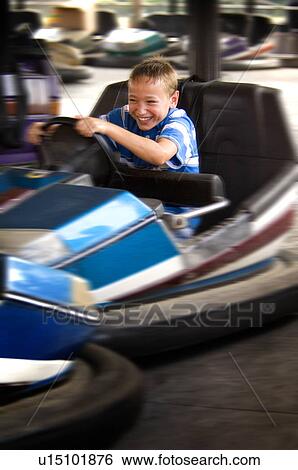 Stock Photograph - Kid on a carnival ride. Fotosearch