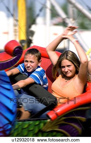 Kids on a carnival ride View Large Photo Image Stock Photo - Kids on a carnival ride. Fotosearch