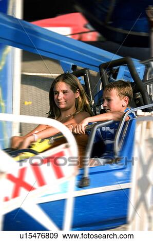 Stock Photo - Kids on a carnival ride. Fotosearch