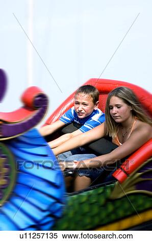 Stock Photography - Kids on a carnival ride. Fotosearch