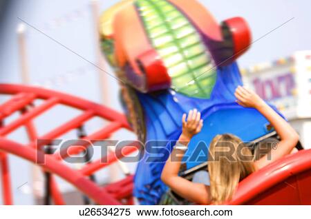 Kids on a carnival ride View Large Photo Image Stock Photography - Kids on a carnival ride. Fotosearch