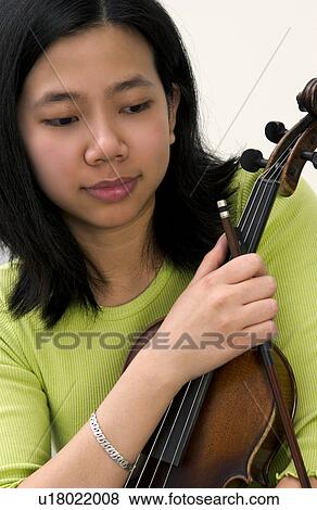 Stock Photo - Asian girl with violin. Fotosearch