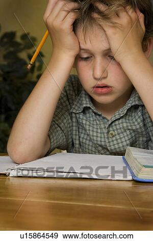 Boy doing homework View Large Photo Image Stock Photo - Boy doing homework. Fotosearch