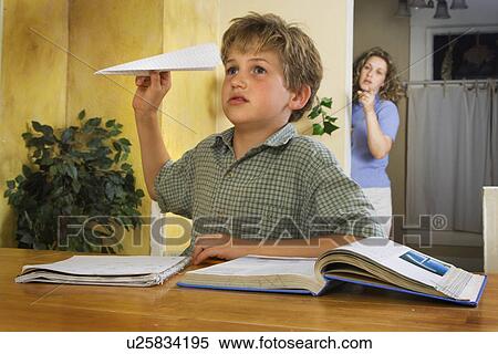 Stock Photography - Boy doing homework. Fotosearch