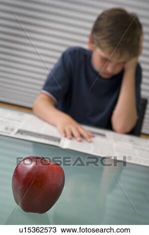 Boy reading newspaper View Large Photo Image Stock Image - Boy reading newspaper. Fotosearch