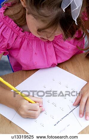 Stock Photography - Girl doing homework. Fotosearch