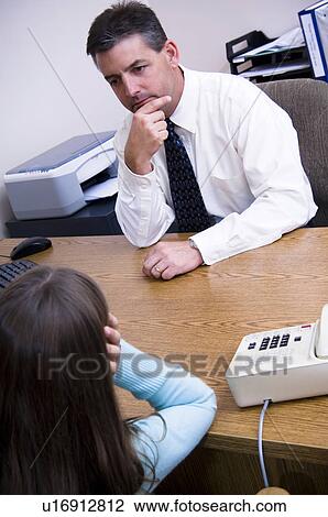 Stock Image - Girl getting counseling. Fotosearch