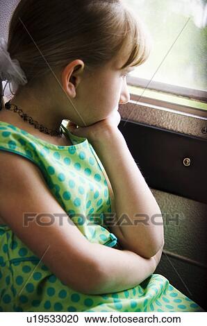 Stock Image - Girl on school bus. Fotosearch