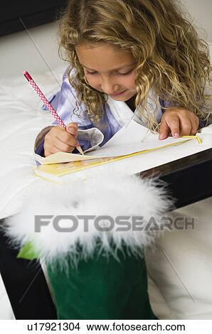 Girl writing letter to Santa View Large Photo Image Picture - Girl writing letter to Santa. Fotosearch