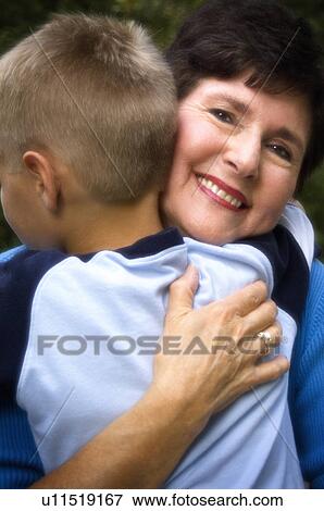 Stock Photo - Grandson hugging grandma. Fotosearch
