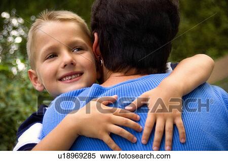 Stock Photography - Grandson hugging grandma. Fotosearch