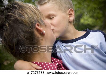 Stock Image - Mother and son kissing. Fotosearch