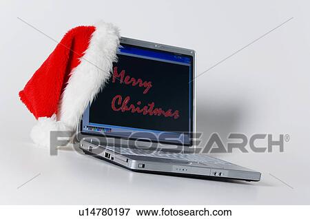 Laptop with santa hat View Large Photo Image Stock Photo - Laptop with santa hat. Fotosearch