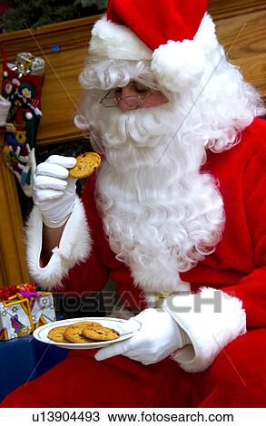 Santa with plate of cookies View Large Photo Image Stock Image - Santa with plate of cookies. Fotosearch