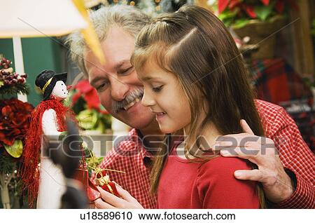 Grandpa and granddaughter christmas shopping View Large Photo Image Stock Image - Grandpa and granddaughter christmas shopping. Fotosearch