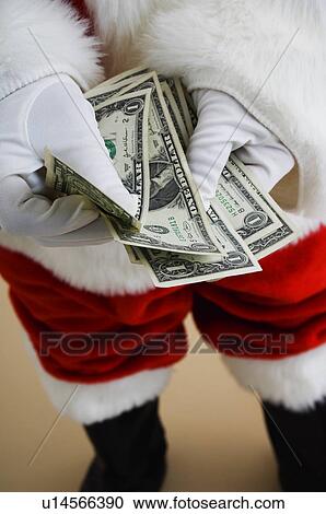 Santa counting money View Large Photo Image Stock Image - Santa counting money. Fotosearch