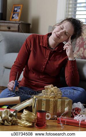 Woman wrapping gifts View Large Photo Image Stock Photo - Woman wrapping gifts. Fotosearch