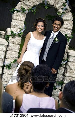 Picture - Bride and Groom at altar. Fotosearch