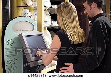 Stock Photo - Couple at a wedding registry. Fotosearch