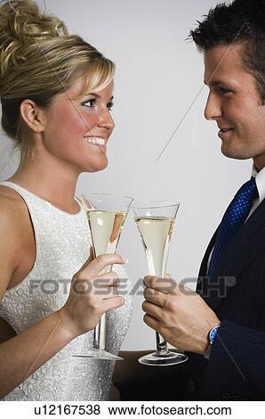 Couple celebrating New Year's View Large Photo Image Stock Photo - Couple celebrating New Year's. Fotosearch