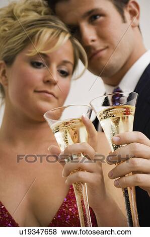 Couple celebrating View Large Photo Image Stock Photo - Couple celebrating. Fotosearch