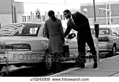 Stock Photo - Couple getting into cab. Fotosearch