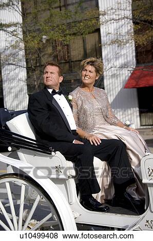 Stock Photo - Couple on horse drawn carriage ride. Fotosearch
