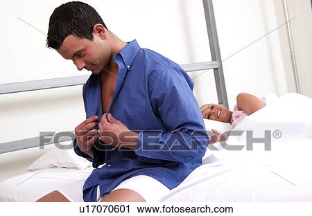 Man getting out of bed View Large Photo Image Stock Image - Man getting out of bed. Fotosearch