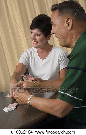 Picture - Senior couple playing cards. Fotosearch