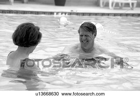 Senior couple swimming View Large Photo Image Stock Image - Senior couple swimming. Fotosearch