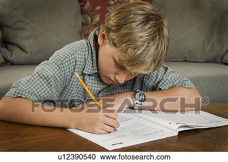 Boy doing homework View Large Photo Image Stock Image - Boy doing homework. Fotosearch