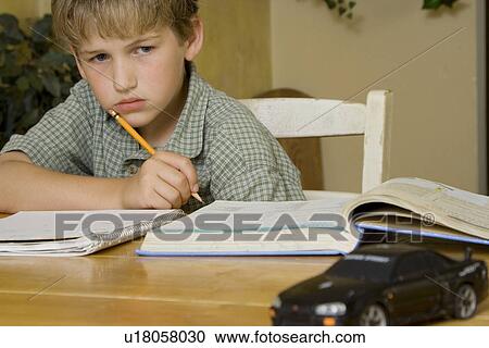 Boy doing homework View Large Photo Image Stock Image - Boy doing homework. Fotosearch