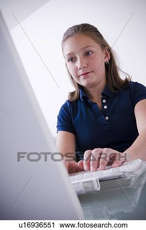 Girl at computer View Large Photo Image Stock Image - Girl at computer. Fotosearch